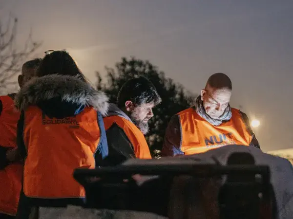Photo de plusieurs bénévoles de la Nuit de la solidarité dans un campement
